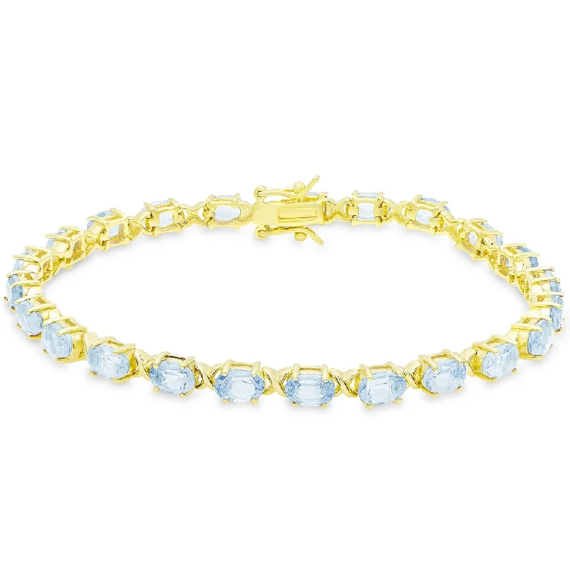 Woven thread bangles-Dolce Giavonna Gold Over Sterling Silver Oval Cut Blue Topaz XO Link Bracelet