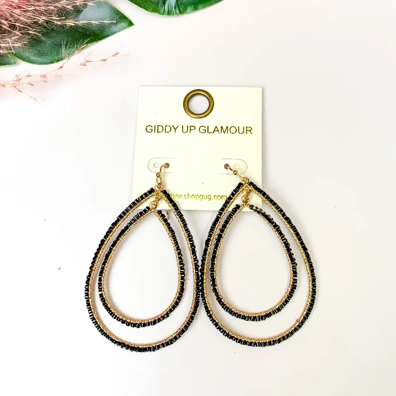 Flat badge earrings-Double Open Teardrop Gold Tone Earrings with Beaded Outline in Black